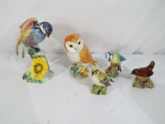Beswick - five models of birds by Beswick Pottery comprising model No.