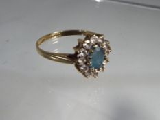 A lady's hallmarked 9 carat gold Topaz and CZ cluster ring, size Q, approximate weight 2.08 grams.