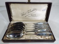 A cased set of six white metal spoons,