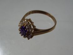 A lady's 9 carat yellow gold cluster ring set with dual-colour synthetic stones, size P, approx 2.
