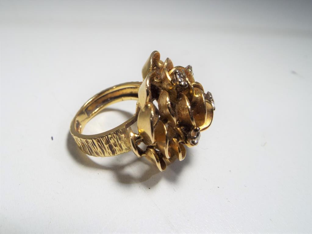 A lady's hallmarked 18 carat gold flower ring set with a central 15 pt brilliant cut diamond and a - Image 2 of 3