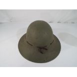 A World War Two (WW2) Japanese civil defence helmet with leather internals