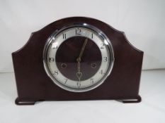 A good quality bakelite mantel clock with pendulum and key