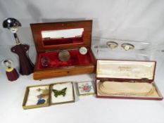 A good quality jewellery box containing a powder compact by Dhaussy,