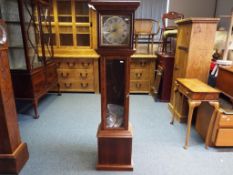 A grandmother clock with pendulum and weight,
