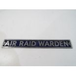 An aluminium sign displaying the words AIR RAID WARDEN 22cm X 3cm - NOTE: Please read 'Important