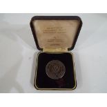 A solid sterling silver hallmarked commemorative medallion celebrating Liverpool Football Club's