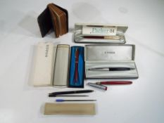 Parker - a small quantity of pens to include a ballpoint Parker pen, a Parker fountain pen,