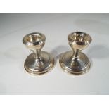 A matched pair of hallmarked silver dwarf candlesticks,
