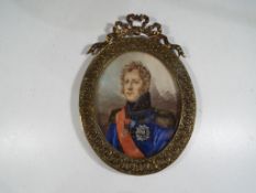 A portrait probably Louis Philippe painted in oil on ivory within a gilded metal oval frame,