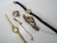 A hallmarked 9 carat gold Everite lady's wristwatch, a hallmarked 9 carat gold watch lacking strap,