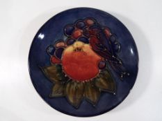 Moorcroft Pottery - A pin dish by Moorcroft Pottery in the Finches and Fruit pattern on a blue