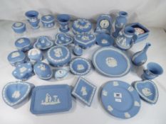 Wedgwood Jasperware - in excess of 35 pieces of Wedgwood Jasperware decorated in the powder blue