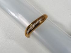 A lady's 9 carat gold 10 pt diamond channel set ring, size K + 1/2, 1.