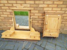 A pine over mantel mirror 97 cm x 106 cm x 29 cm and a further wall mounted pine cabinet,
