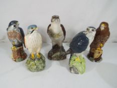 Five ceramic whisky decanters in the form of birds of prey comprising Royal Doulton Kestral,