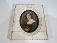 A good quality ivory framed oval picture
