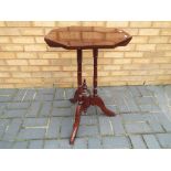 A hexagonal occasional table, 74 cm x 48