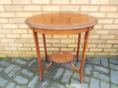 A good quality mahogany inlaid oval occasional table, approximately 74 cm (h) x 66 cm x 48 cm.