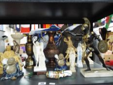 A good collection of figurines to include a good quality brass figure on a marble plinth,