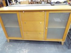 A good quality modern three drawer sideboard with two glazed doors approx 90cmx 155cm x 43cm Est