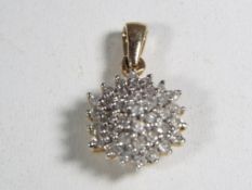 A hallmarked 9 carat gold and 0.50 carat diamond pendant.