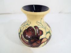 Moorcroft - a Moorcroft vase decorated in the Chocolate Cosmos pattern, approximate height 9.5 cm.