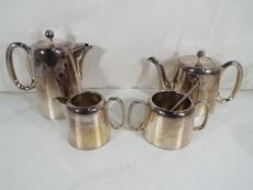 A four piece silver plated tea service comprising teapot, coffee pot, milk jug and sugar bowl.