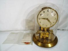 An early battery driven Junghans Ato 1000-day brass mantel clock,