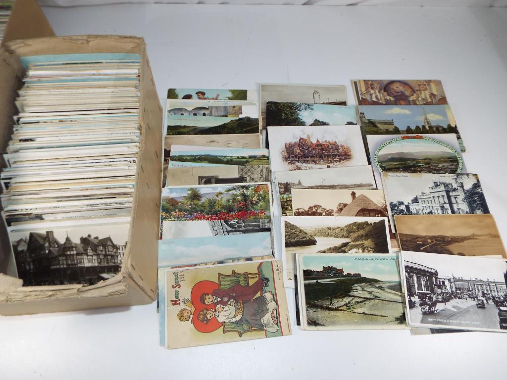 In excess of 500 early-mid period UK and foreign topographical postcards to include street scenes,