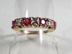 A lady's hallmarked 9 carat yellow gold ruby and diamond ring, size Q and a half,