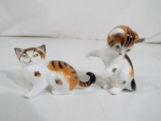Two Royal Doulton miniature cats.
