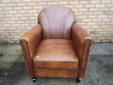 A modern good quality brown leather Art Deco style easy armchair Est £40 - £60