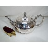 A good quality plated teapot and a heavy brass pin cushion in the form of a pig (2)