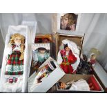 Two boxes containing a quantity of good quality dressed dolls by The Leonardo Collection,