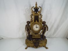 A large, impressive classically styled mantel clock, the main body cast brass of lyre-form,