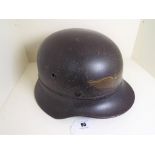 World War Two (WW2) - a German helmet marked Luftscutz with spread wings to the fore,