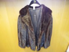 A good quality lady's fur coat, with slit pockets,