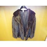 A good quality lady's fur coat, with slit pockets,