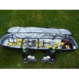 A good quality Nevica ski bag containing a pair of skis and Dalbello boots,