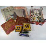 A quantity of vintage cigarette cards, three vintage newspapers,