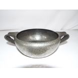 Pewter - a Tudric twin-handled pewter bowl by Archibald Knox circa 1906 inscribed to the base