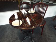 A faux marble round table approx 73cm (h) x 70cm (d) with two bentwood chairs