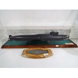 A 1:200 scale model of a Russian submarine in display case, with presentation inscription,