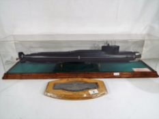 A 1:200 scale model of a Russian submarine in display case, with presentation inscription,
