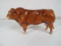 Beswick Pottery - A John Beswick ceramic model of a Limousin bull with ringed nose,