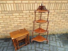 A nest of three oak tables and a decorative four tier whatnot Est £30 - £50