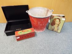 A vintage cast metal fire bucket also include in the lot is a metal cast box and two vintage tins