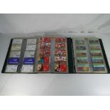 Two albums containing approximately 550 phonecards, BT and similar comprising standard,