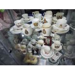 Three shelves of Royal commemorative ceramics,